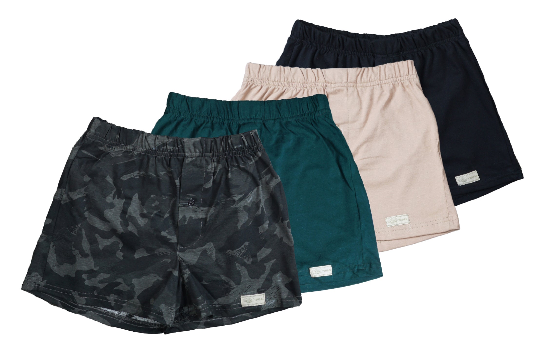 Front view of four pairs of Go Wild Boxers, one Black, one Tan, one Green, and one Gray Camouflage. Each have an elastic waistband, a buttoned front fly, and a Tag Buffalo label on the bottom front of the left leg. 100% cotton.--1