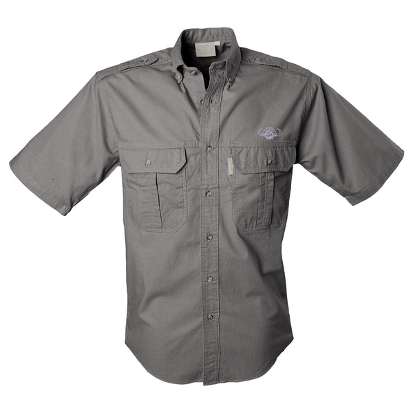 Front view of a Men's Trail Shirt with Buffalo Logo in Short Sleeves, color Olive. The shirt has two flap-covered chest pockets with an embroidered Tag buffalo logo above the left pocket, button-down collars, functional cross-stitched shoulder straps, a button-front placket, double stitching throughout, and long rounded tails for tucking into pants. 100% cotton.