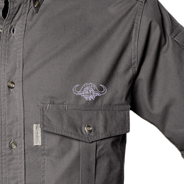 Closeup of a Men's Shooter Shirt with Buffalo Logo in Short Sleeves, color Olive. The shirt has a flap-covered chest pocket on the left side with an embroidered Tag buffalo logo above, button-down collars, a button-front placket, and double stitching throughout. 100% cotton.