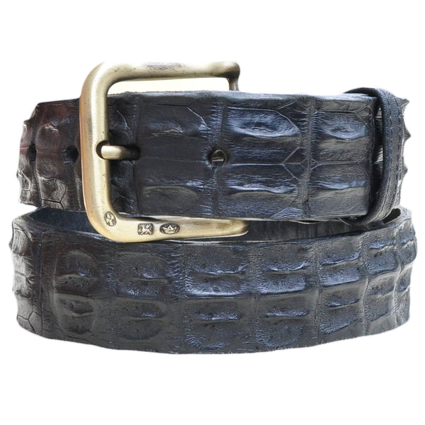 Front view of a Nile Crocodile Game Skin Belt, color Black. The belt has a solid brass buckle, five waist adjustment positioning holes, two Chicago-style belt length adjustment screws, a matching leather keeper loop, and a Tag Safari logo branded inside. Genuine game skin leather.