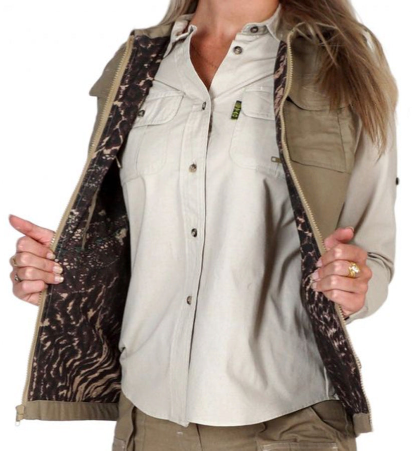 Front of a Women's Safari Vest, color Khaki. The vest has a protective fold-up collar, two flap-covered chest pockets, two large flap-covered pockets at the waist, a zippered security pocket inside, a full zippered front, a printed cotton inside liner, and double stitching throughout. 100% cotton.--5