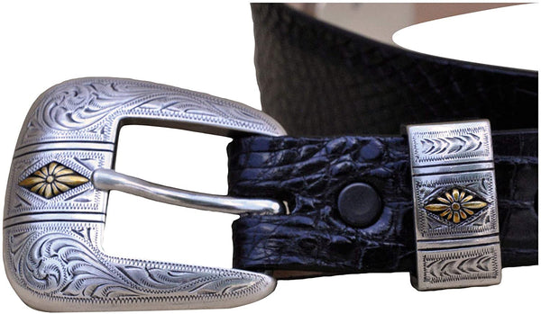 Closeup of a Caiman Crocodile Game Skin Ranger Belt, color Black. The belt has a two-tone engraved  brass buckle and keeper loop, and two Chicago-style belt length adjustment screws. Genuine game skin leather.