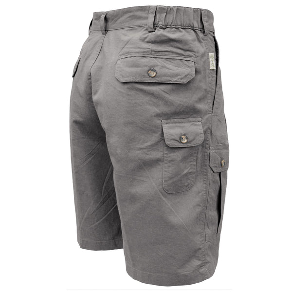 Back view of the Mens Adventure Shorts in Cotton Olive with Large Cargo Pockets fron back and a knife pocket. All the pockets have button down flaps and the shorts has a front zipper, belt looks and elastic side detail. The shorts has Pleats on the front, and slanted side pockets. These shorts are 9 inches in length, sitting just above the knee