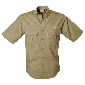 Front view of a Men's Trail Shirt with Buffalo Logo in Short Sleeves, color Khaki. The shirt has two flap-covered chest pockets with an embroidered Tag buffalo logo above the left pocket, button-down collars, functional cross-stitched shoulder straps, a button-front placket, double stitching throughout, and long rounded tails for tucking into pants. 100% cotton.