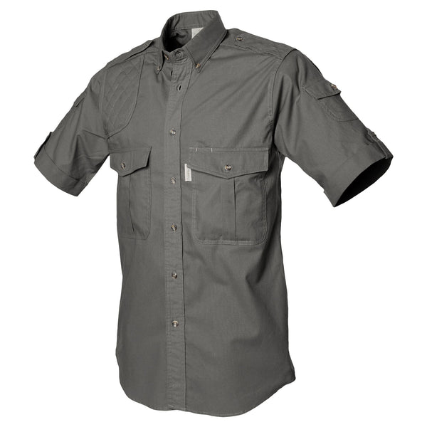 Side view of a Men's Shooter Shirt in Short Sleeves, color color Olive. The shirt has a quilted shooting pad at the right shoulder, ammo pockets on the sleeves, two flap-covered chest pockets, button-down collars, functional cross-stitched shoulder straps, a button-front placket, double stitching throughout, and long rounded tails for tucking into pants. 100% cotton.