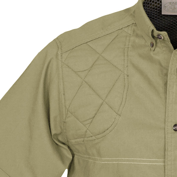 Closeup of a Men's Clay Bird Shirt in Short Sleeves, color Khaki. The shirt has a quilted recoil pad at the right shoulder, a mesh-lined vented back, a stitched FITASC gun position line, button-down collars, a button-front placket, and double stitching throughout. 100% cotton.