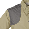 Closeup of a Men's Upland Shirt in Short Sleeves, color Khaki/Olive. The shirt has a contrasted quilted shooter patch at the right shoulder, button-down collars, a button-front placket, and double stitching throughout. 100% cotton.