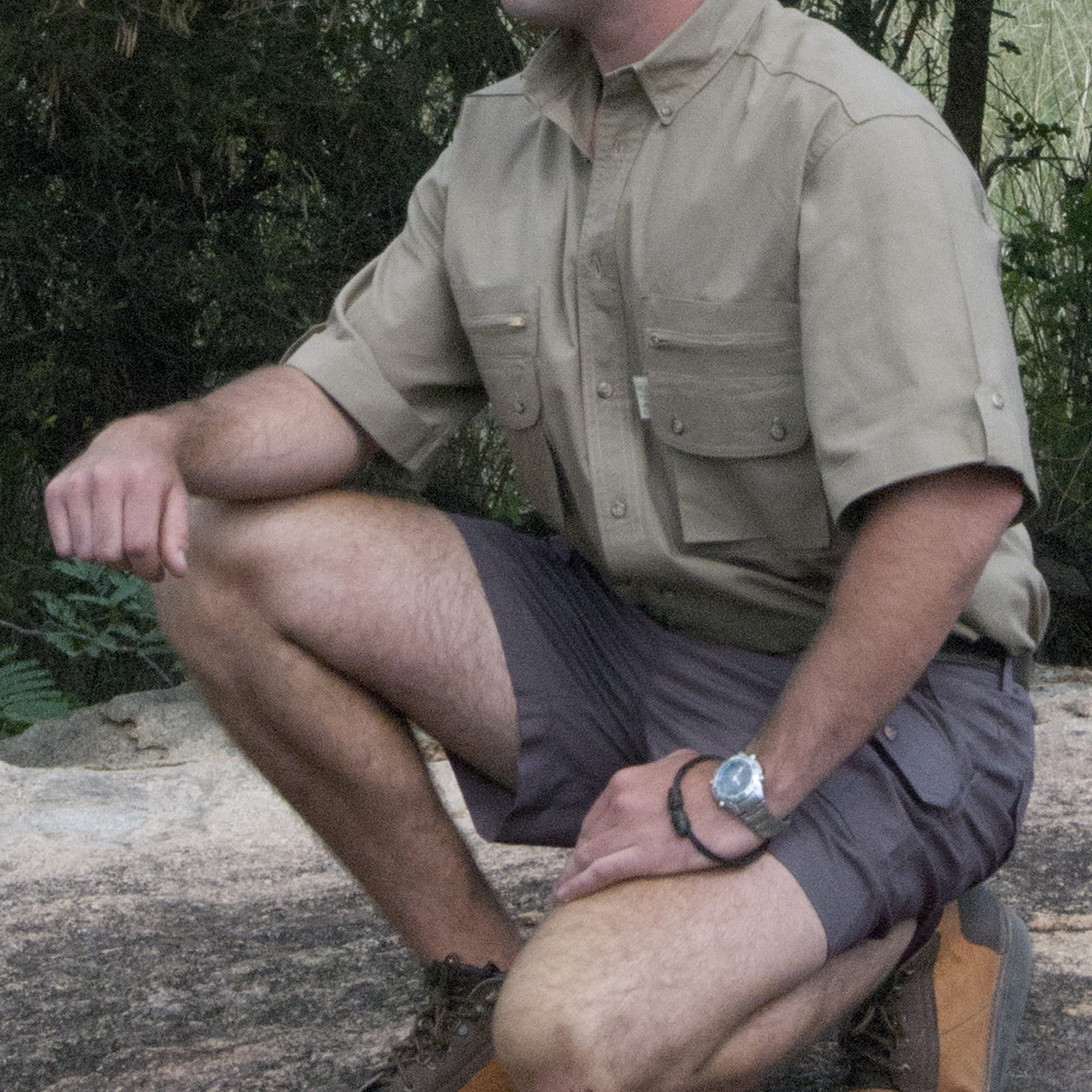 Safari Pro Hunter Shorts for Men feature slash-style side pockets, button-flap thigh and back pockets, discreet elastic waist panels, large belt loops, and a 5 1/2