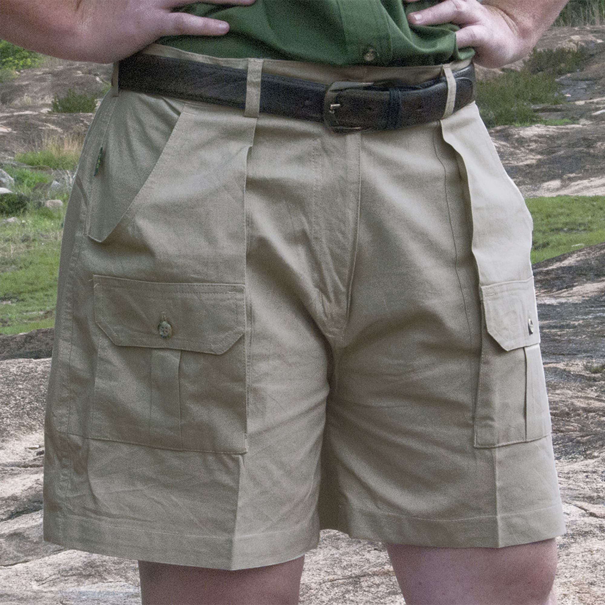 Tag Safari Pro Hunter Shorts for Women feature slash-style side pockets, button-flap thigh and back pockets, discreet elastic waist panels, large belt loops, and a 5 1/2
