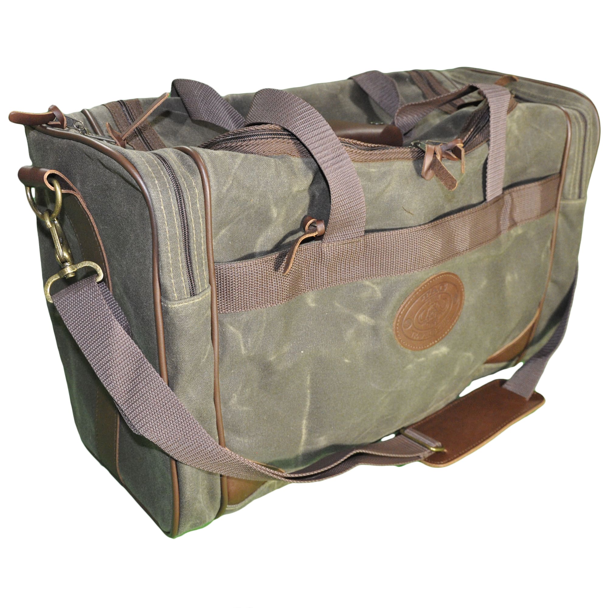 Front and left side of a Tag Safari Waxed Cotton Canvas Duffle Bag in Olive Green. Shows a large zippered top, zippered side pouches, an adjustable web-style shoulder strap with cushion, web-style handles, and an embossed Tag logo leather patch.--2