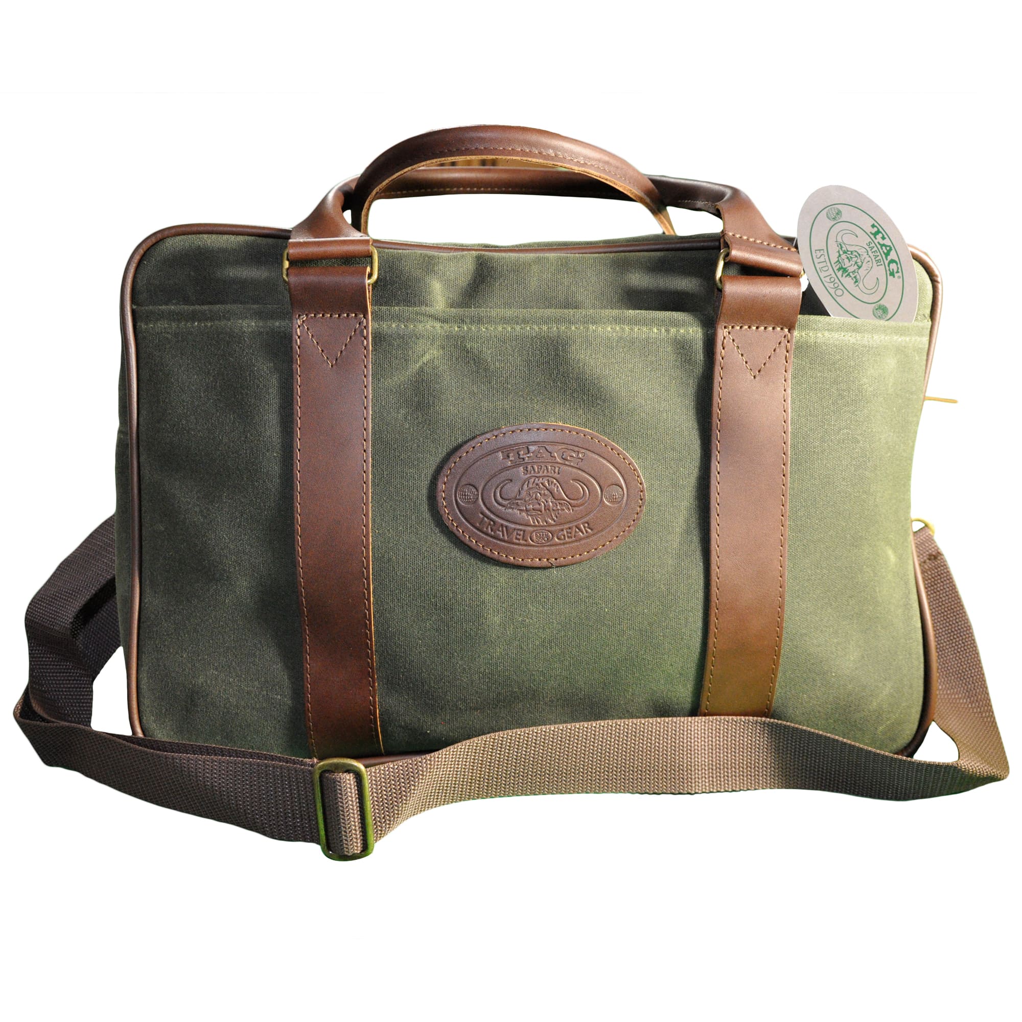 Front of a Tag Safari Waxed Cotton Canvas Weekender Bag in Field Tan. Shows a zippered top, a large front drop-in pocket, an adjustable web-style shoulder strap, cushioned leather handles, and an embossed Tag logo leather patch.--4