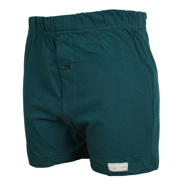 Side view of a pair of Go Wild Boxers, color Green. The boxers have an elastic waistband, a buttoned front fly, and a Tag Buffalo label on the bottom front of the left leg. 100% cotton.