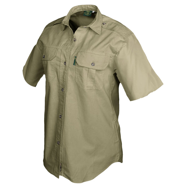 Side view of a Woman's Trail Shirt in Short Sleeves, color Khaki. The shirt has two flap-covered chest pockets, functional cross-stitched shoulder straps, a button-front placket, double stitching throughout, and long rounded tails for tucking into pants. 100% cotton.