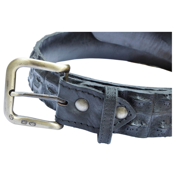 Closeup of a Nile Crocodile Game Skin Belt, color Black. The belt has a solid brass buckle, two Chicago-style belt length adjustment screws, and a matching leather keeper loop. Genuine game skin leather.