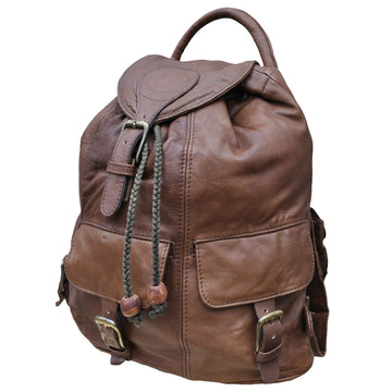 Buffalo Leather Backpack from Tag Safari in Brown features a buckled-flap top with embossed Tag logo, a cushioned handle, front and side flap-covered pockets, and adjustable padded shoulder straps with small flap-covered pouches.