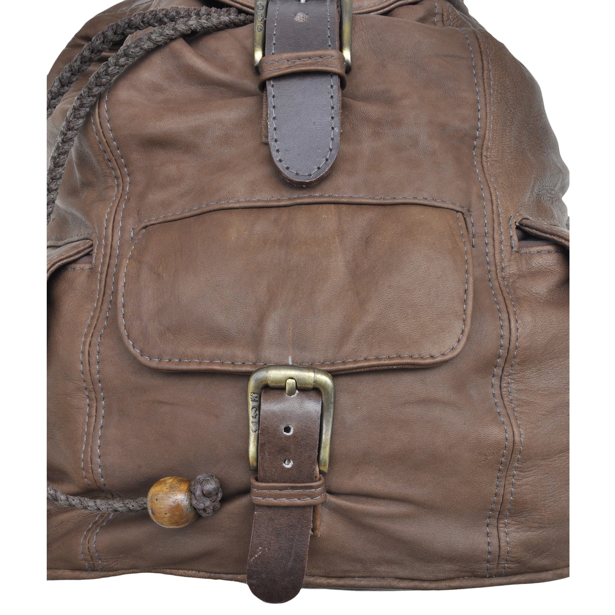 Buffalo Leather Backpack from Tag Safari in Brown features a buckled-flap top with embossed Tag logo, a cushioned handle, front and side flap-covered pockets, and adjustable padded shoulder straps with small flap-covered pouches.--4