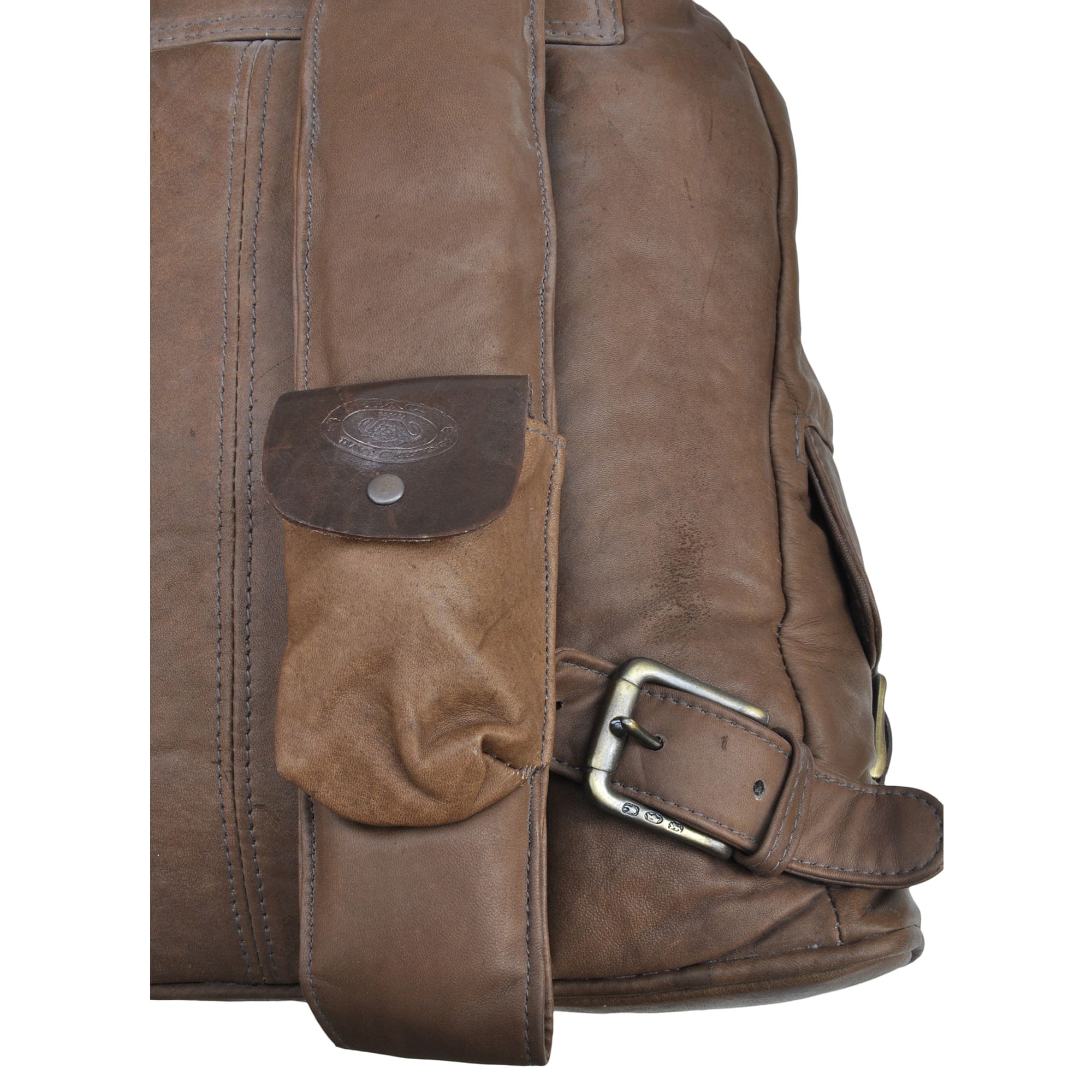 Buffalo Leather Backpack from Tag Safari in Brown features a buckled-flap top with embossed Tag logo, a cushioned handle, front and side flap-covered pockets, and adjustable padded shoulder straps with small flap-covered pouches.--3