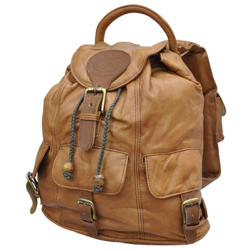 Impala Leather Backpack from Tag Safari in Tan features a buckled-flap top with embossed Tag logo, a cushioned handle, front and side flap-covered pockets, and adjustable padded shoulder straps with small flap-covered pouches.