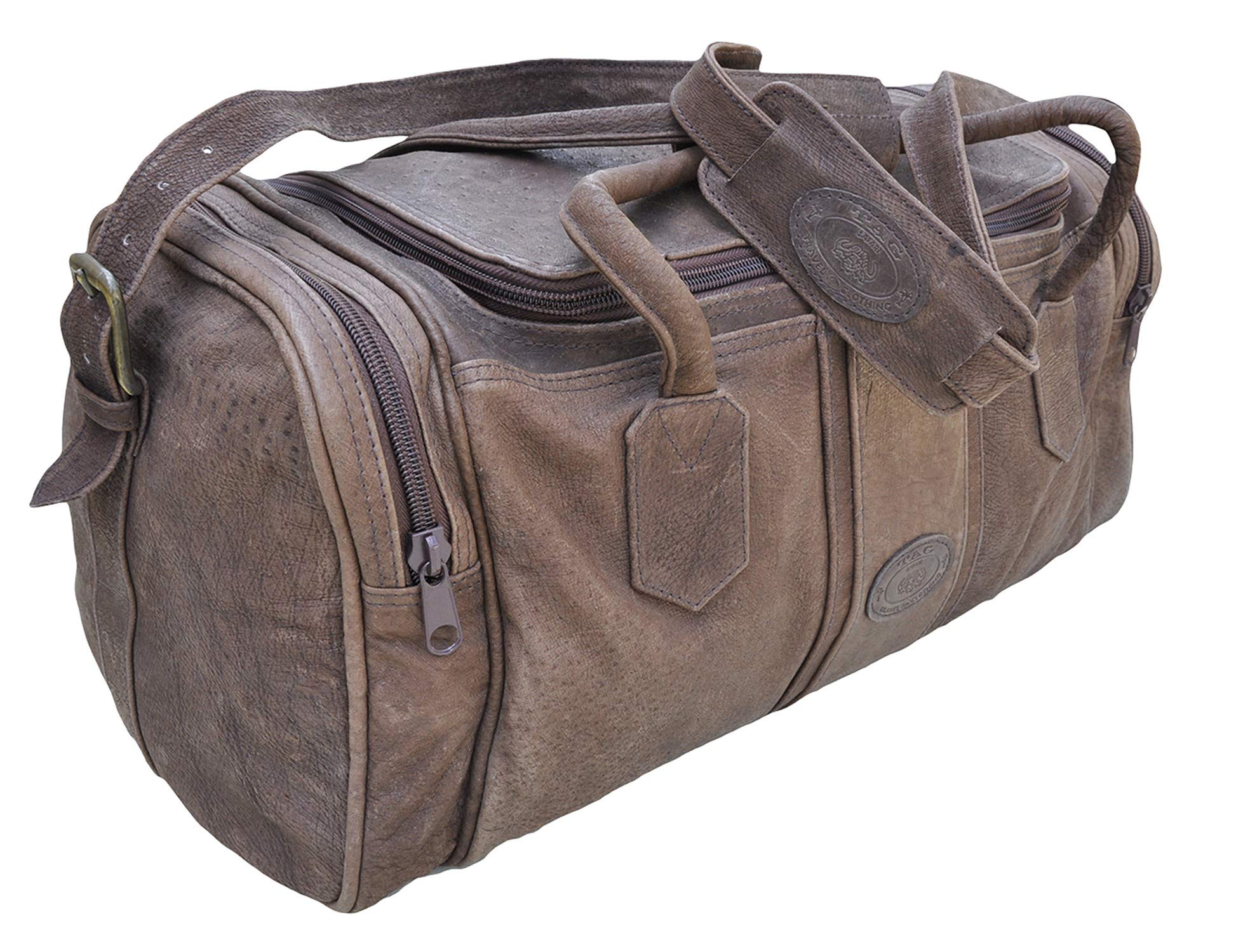Warthog Leather Duffle from Tag Safari in Brown features a zippered top, zippered pouches on each end, an adjustable padded shoulder strap, cushioned handles, and an embossed Tag logo leather patch.--1