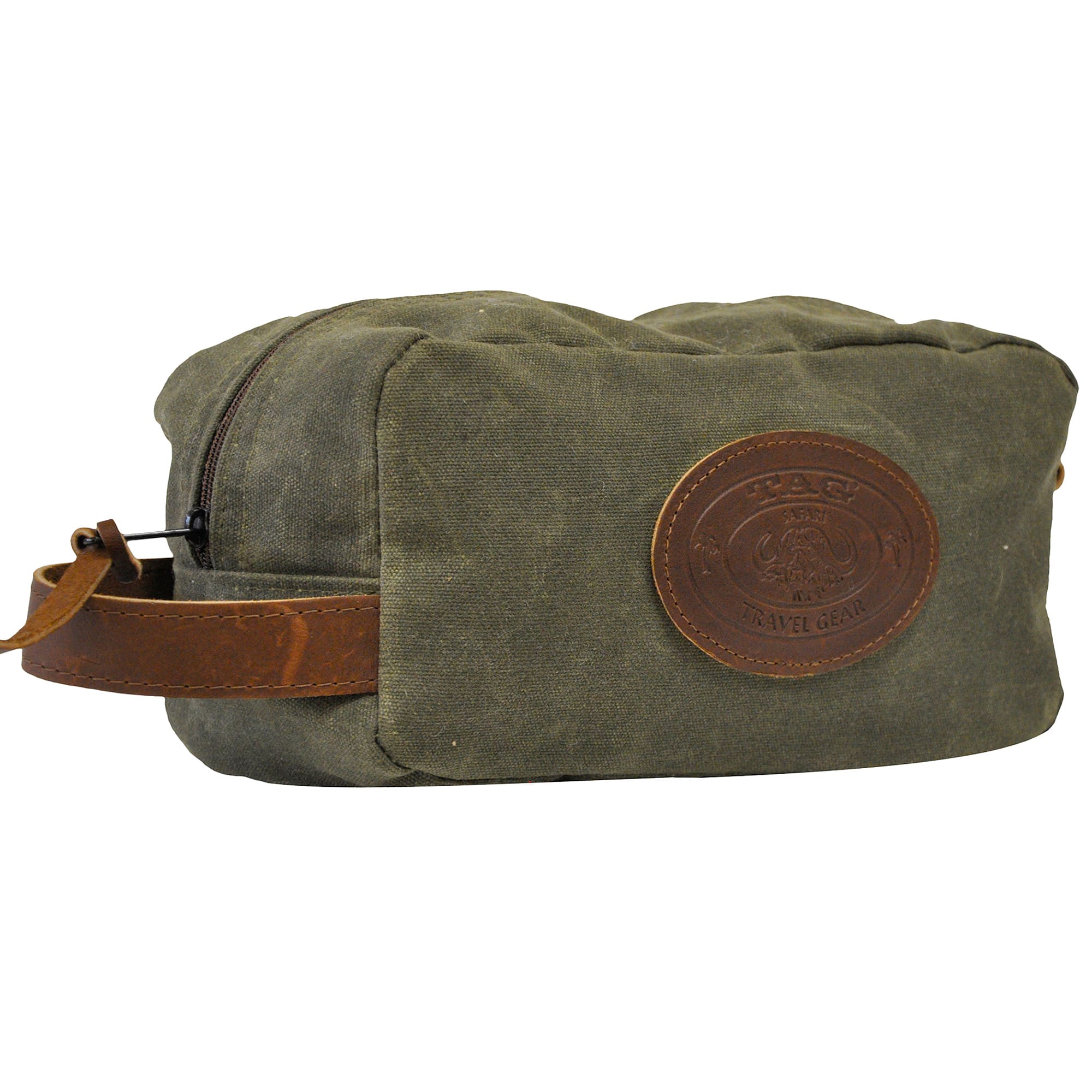 Front and left side of a Tag Safari Waxed Cotton Canvas Toiletry Bag in Olive Green. Shows a zippered top, a leather hand strap, and an embossed Tag logo leather patch.--3