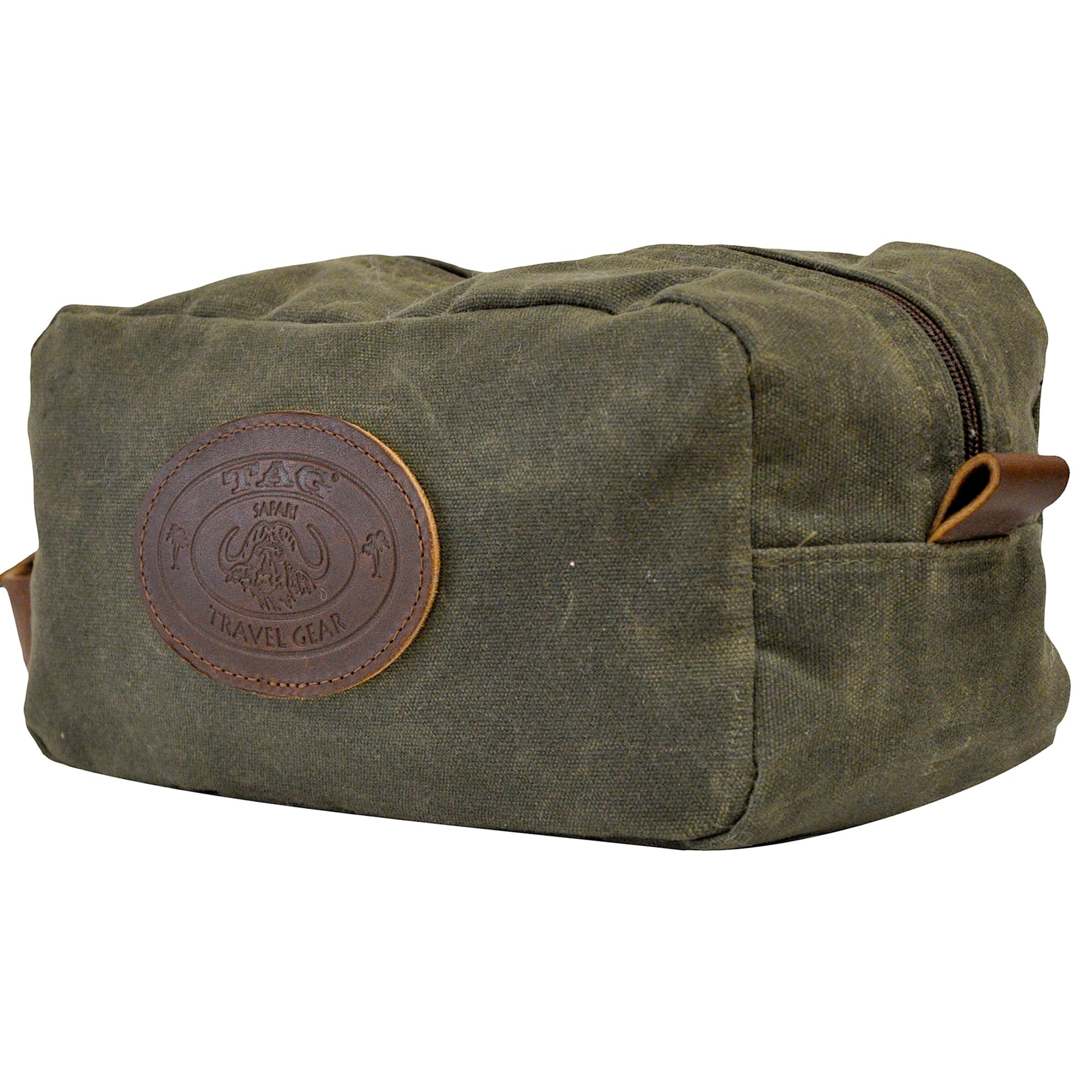 Front and right side of a Tag Safari Waxed Cotton Canvas Toiletry Bag in Olive Green. Shows a zippered top, a leather side loop, and an embossed Tag logo leather patch.--4