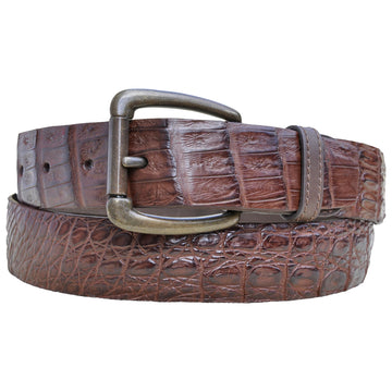 Front view of a Caiman Crocodile Game Skin Belt, color Brown. The belt has a solid brass buckle, five waist adjustment positioning holes, two Chicago-style belt length adjustment screws, a matching leather keeper loop, and a Tag Safari logo branded inside. Genuine game skin leather.